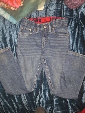 Levi's Men's Medium Blue Straight Jeans with Red Waistband Accent